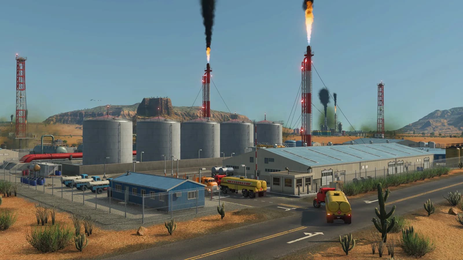 Refinery with chimneys, storage tanks and trucks